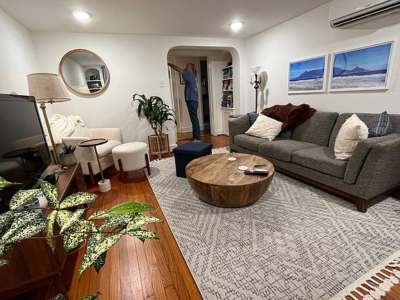 Living room shown with current tenant's furniture