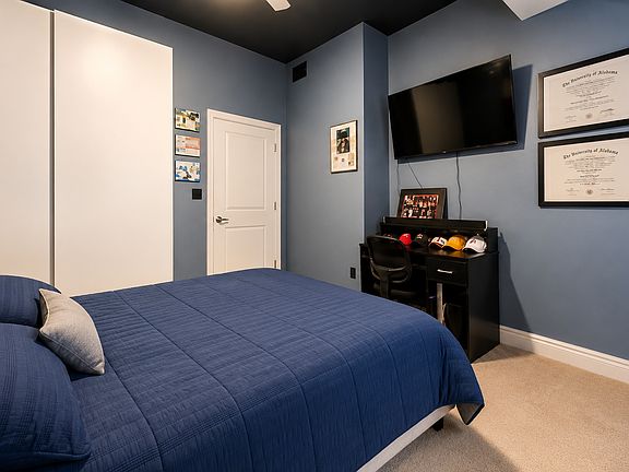 Spacious bedroom fits a king bed