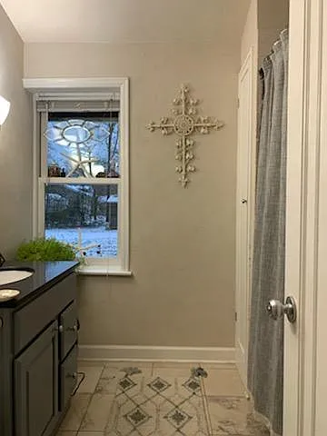 Main floor bathroom with tub and shower.