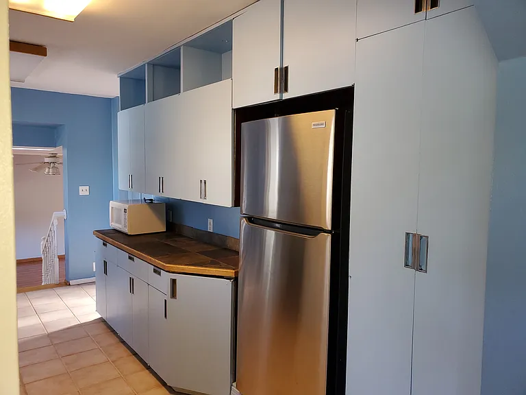 Kitchen has a new refrigerator.