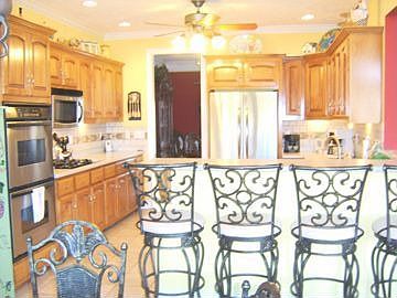 Eat in Kitchen, Heated Floors, Lots of Custom Cabinets