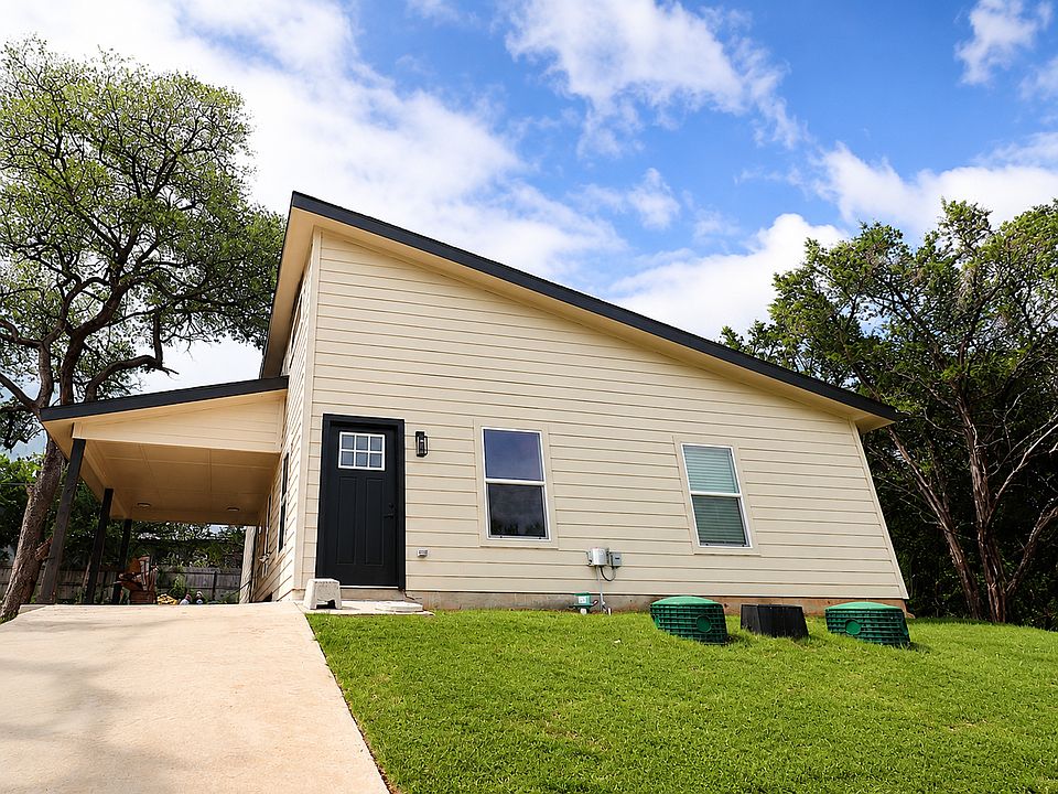 Beautiful modern home with eye-catching curb appeal, a spacious covered carport, and convenient sheltered parking.
