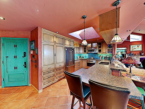 Enter Casa al Luz to a wall of glass, ocean views and the inviting open kitchen.