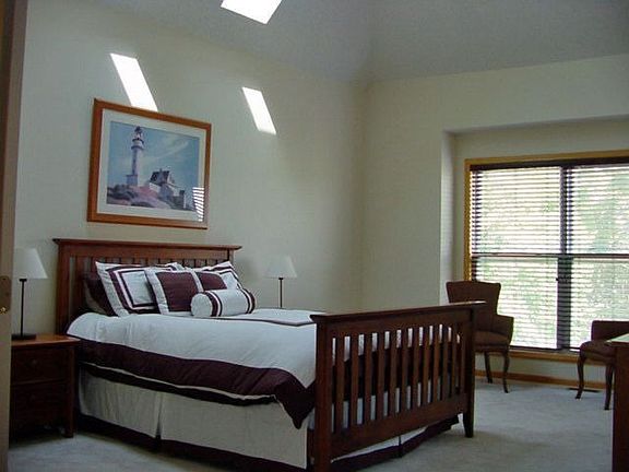 Master bedroom with vaulted ceiling
