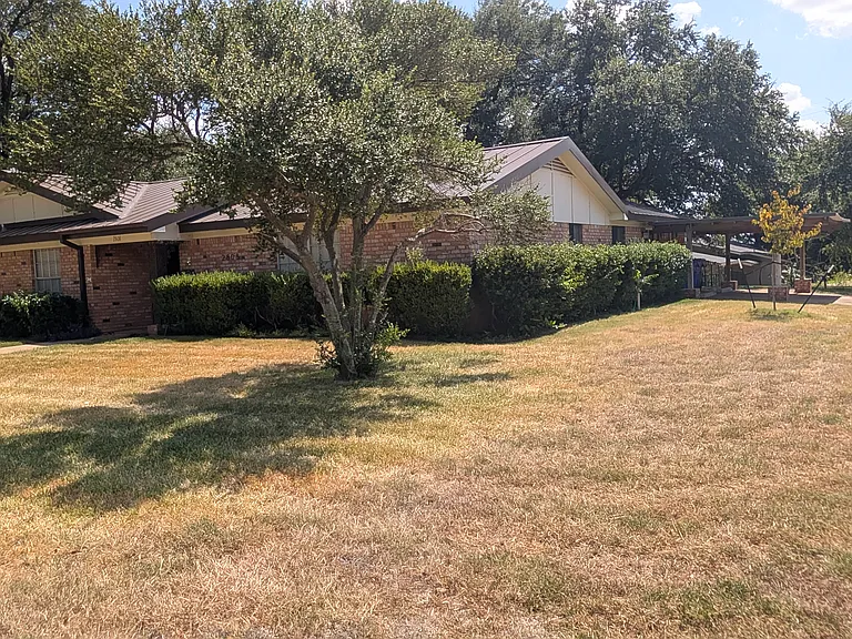 Right End of the House with Carport