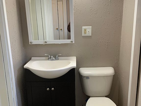 Updated bathroom - new lighting, new toilet, new faucet and fresh paint.