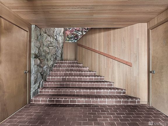 Entrance to home. Gorgeous Brick, Masonry Stone with Tongue &  Groove Hemlock Interior Finishes.