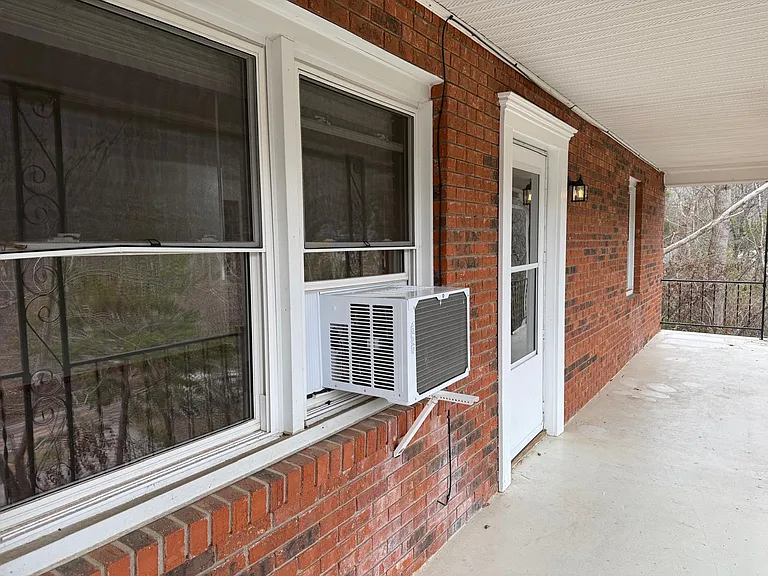 Private End entrance - end apartment with no neighbors on side or behind. Views of the hills and trees out front windows and bedroom.