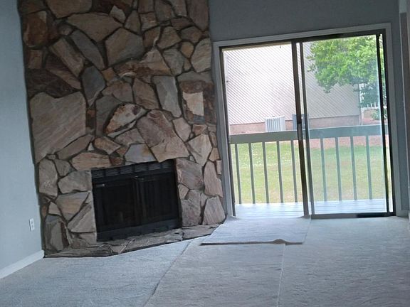 Looking out from the dining area onto the balcony and grassy area