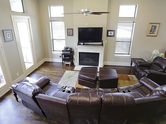 Dark oak floors and an abundance of light welcome you at the top of the stairs!