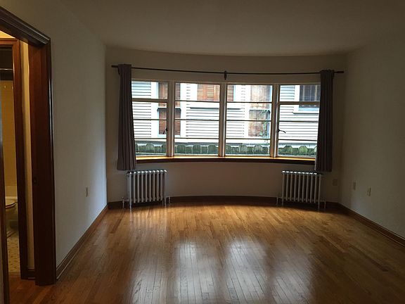 Living room, more spacious than it appears in this photo.