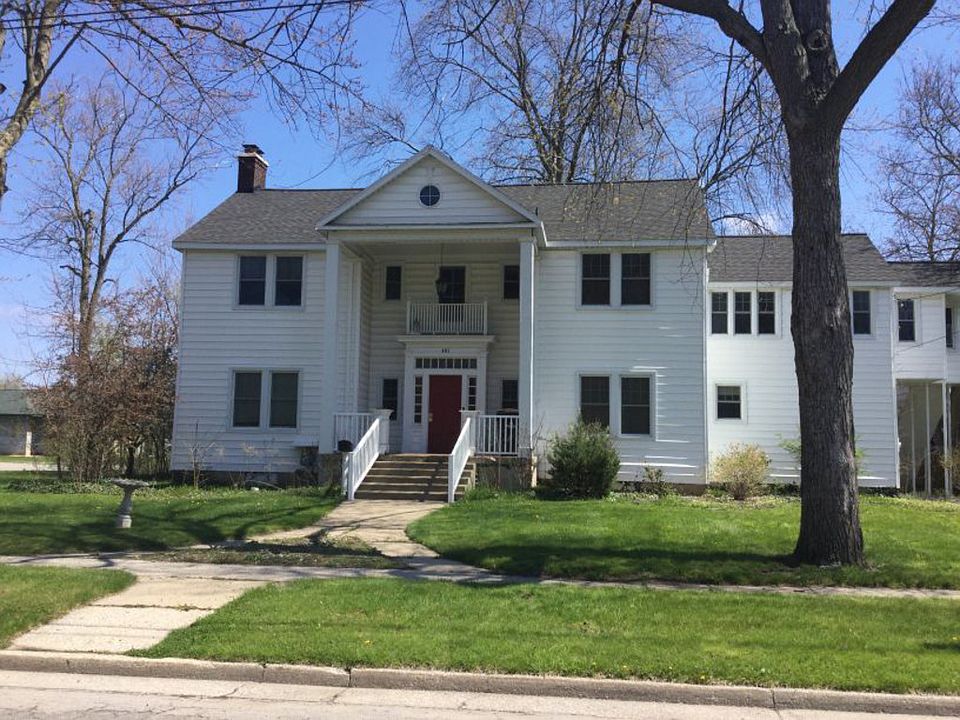 Wonderful investment opportunity with many improvements made over the years.  This home offers three bedrooms and two baths in the main area which is about 1900 square feet and two efficiency 1-bedroom units with separate entrances.   There is also a 2-car attached garage.  The character of the home is unique and one of a kind.     There is a huge living room with fireplace and beautiful hardwood floors in many rooms.   The exterior was updated with vinyl siding and windows and the roof was completed in 2006.  The plumbing was redone along with two new boilers and hot water heater.  The bathrooms are ceramic and are nicely done.   It's time to call and make your appointment today!   