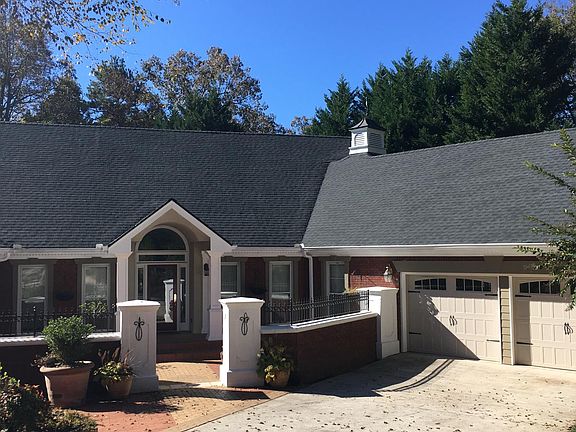 Oversized double garage _26_ x 26_. Elaborate landscaping designed for privacy as well as beauty.