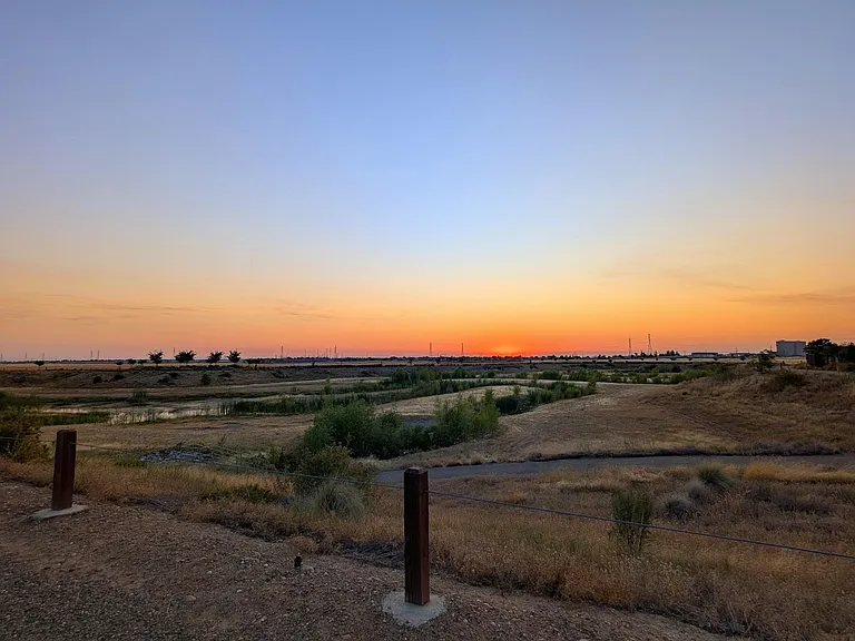 Embrace an active lifestyle with a stunning nature trail just steps from your front door. Enjoy breathtaking sunset views while you jog or stroll through this serene landscape. The perfect blend of tranquility and convenience right in your backyard.