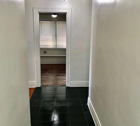 Entryway tile leading to living room and bedrooms