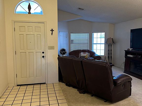Entry & Living, 
The Office/4th Bedroom photos are not included in the photos. But the double doors to the Office/4th BDRM are to the left of this photo