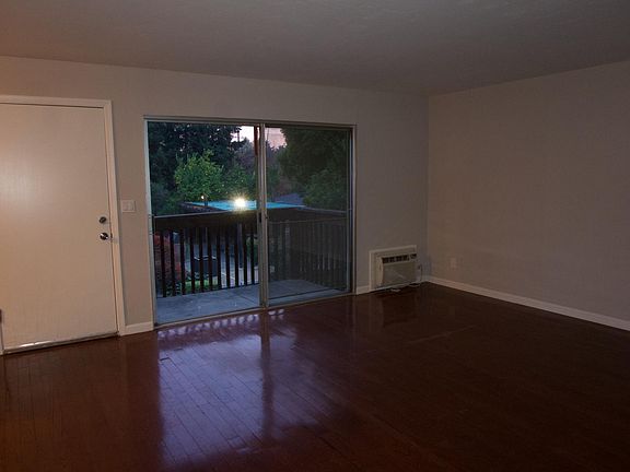 Living Room Facing Entrance & Balcony