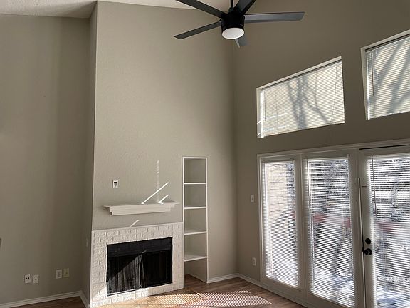 Gas fireplace and built-in bookshelf.