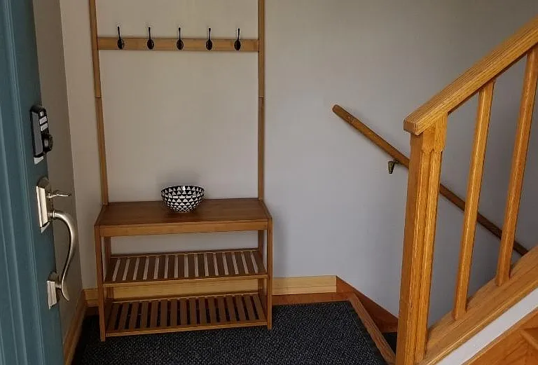 stairs leading to first floor, and up to second floor.