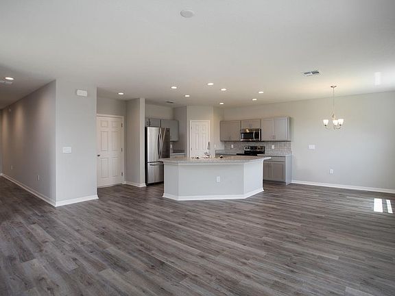 Spacious, open gathering room - Sydney by Highland Homes