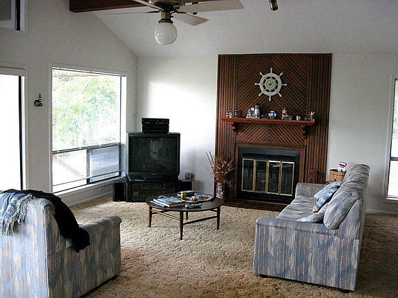 Living area with woodburning fireplace