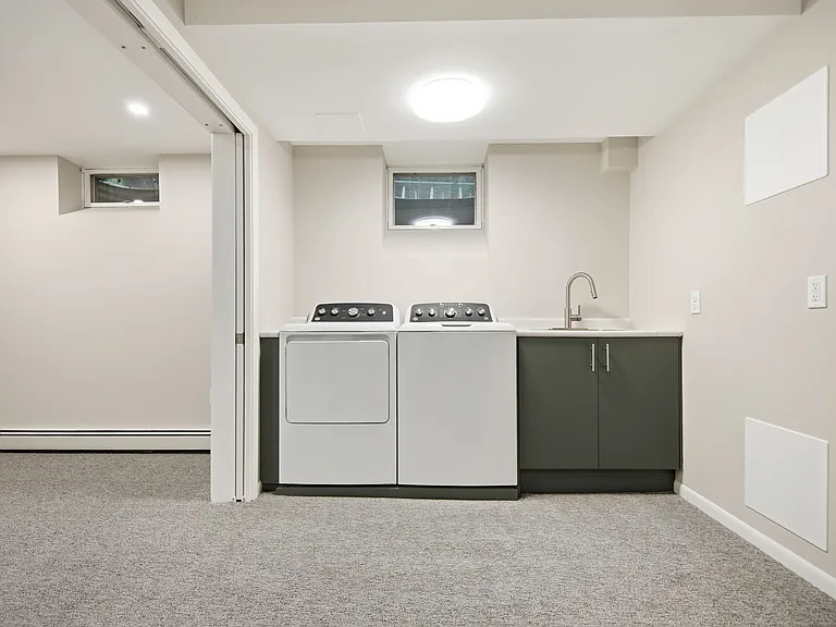 Office / study with sliding French doors opens up to large utility room