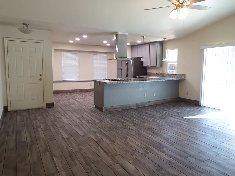 Looking from living room into open concept kitchen/dining