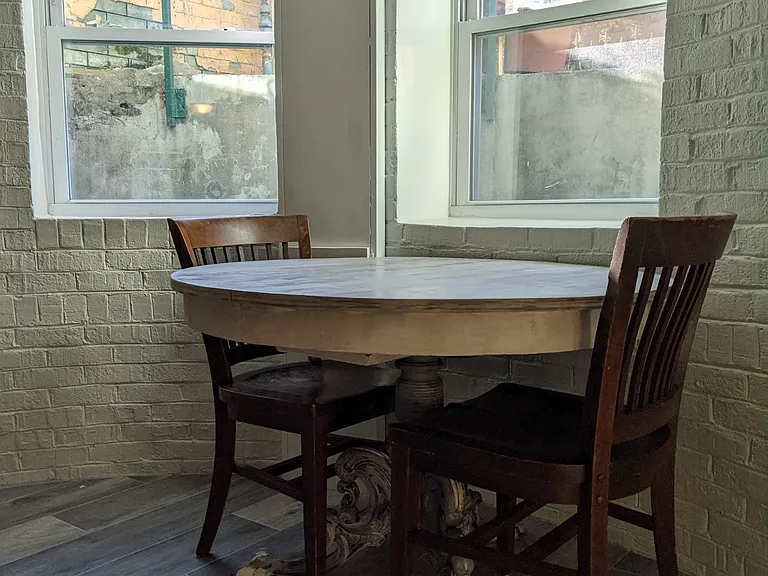 Dining table at front windows.
