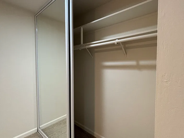 Spacious bedroom closet with
Shelves on the top area