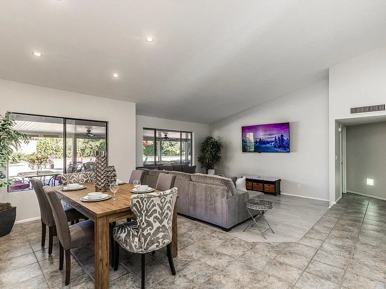 The sectional and TV are a great combo
 So comfortable for watching movies, sports, tv! Beautiful pool view too!