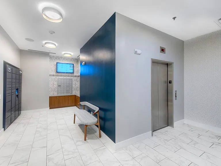 2700 building lobby with Amazon HUB package locker system