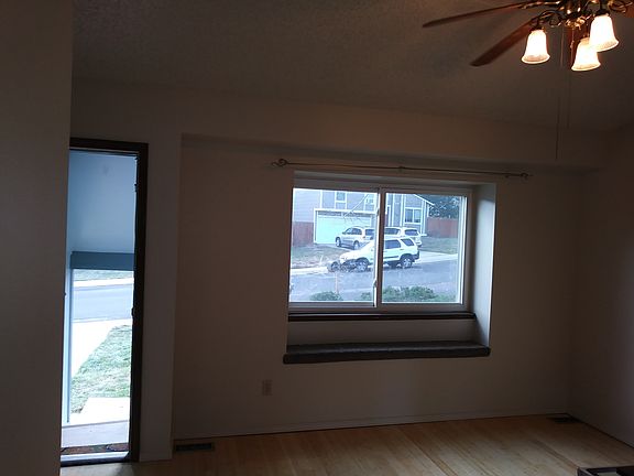 Spacious Living Room with wood floors and mountain views