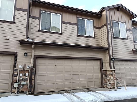 Back of townhome with double car garage