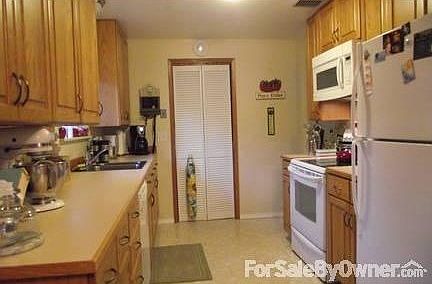 Livinroom
						:
						Hardwood floor and a Lopi Certified Answer Wood Stove Insert