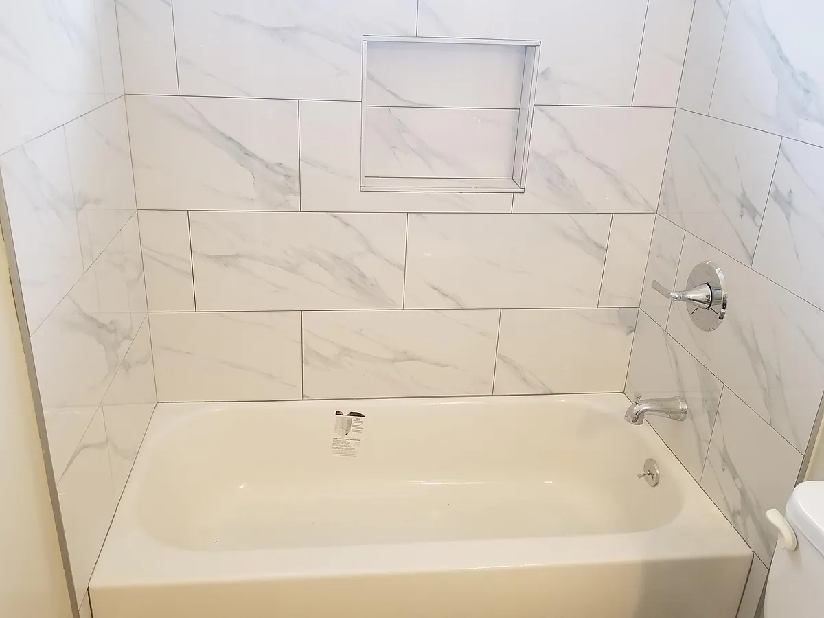 Brand new tub, new designer tile surround, new fixtures. - 22310 Meyler St