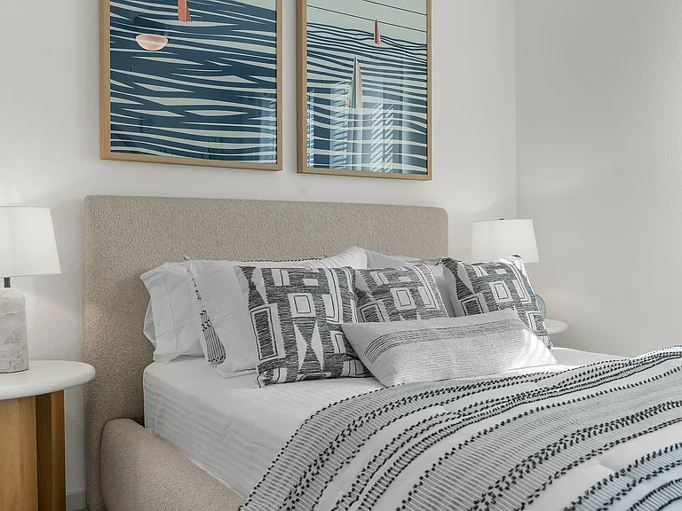 Relax in this serene and stylish bedroom, complete with modern decor and comfort.