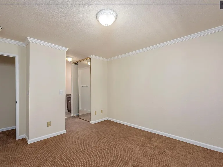 Main bedroom with 2 double sliding door closets.