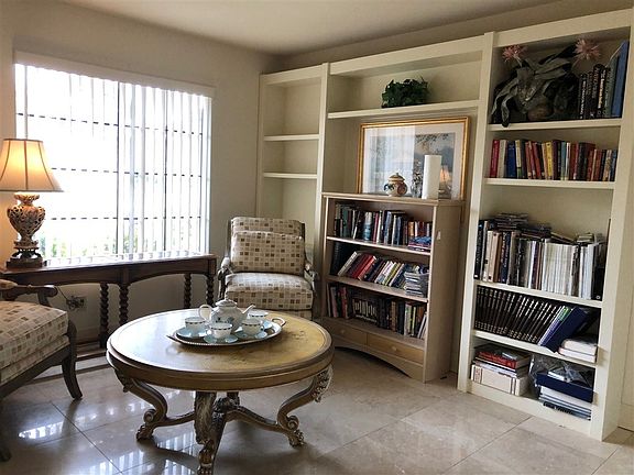 Window looks out over the front yard