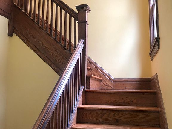 Side entrance stairway foyer. Motion lights installed for stairwell. Dawn/dusk light for outside lower porch. Also motion light on corner of house for lighting of walkway up to house.