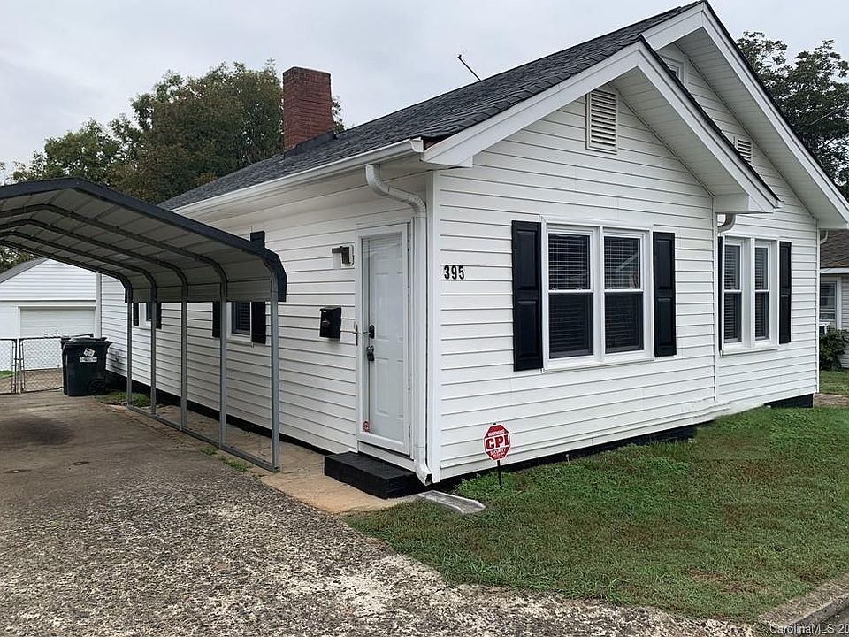 Exterior with entrance on front side and entrance in back. Wired for security system should tenant want to activate it.