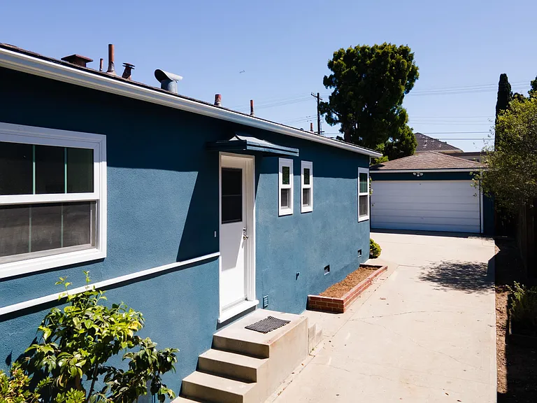 Long drive way to two car garage