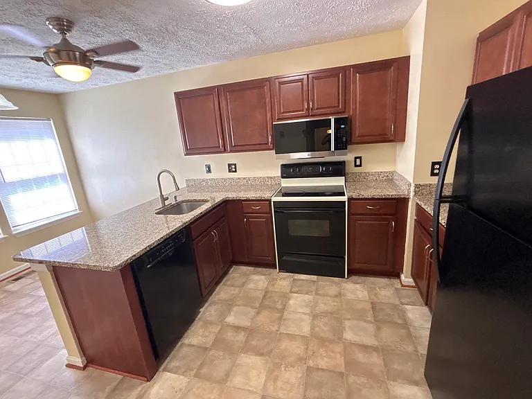 Kitchen dishwasher, range, new microwave appliances/cabinets. Pantry not shown.