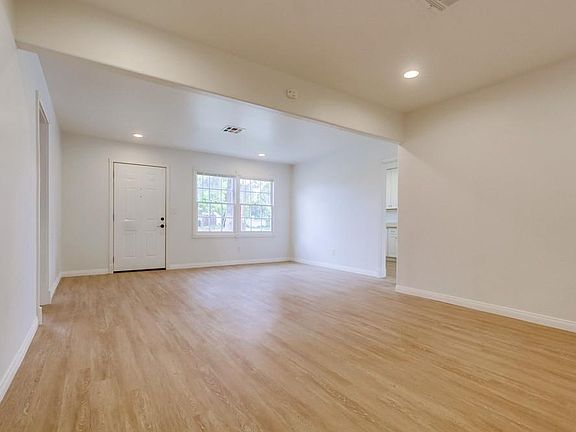 Spacious den and living room with luxury vinyl plank floorin