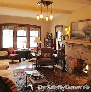 Living Room 27' x 13'
						:
						Loaded with old world charm: wood floors, built-in cabinets & unique fireplace.