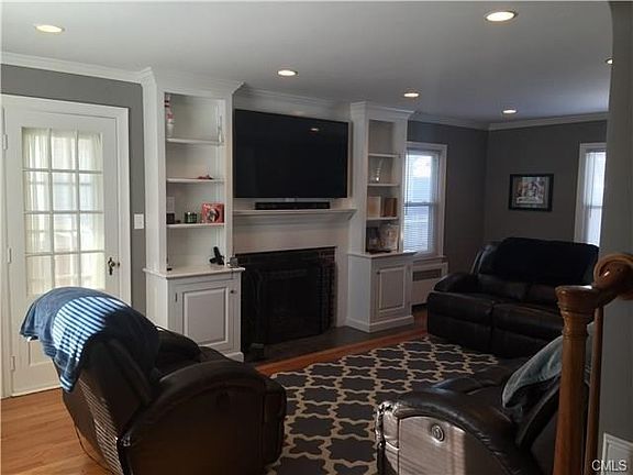 Living room with custom built-ins and fireplace