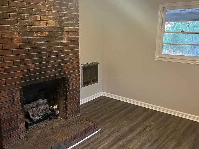 Living Room with Original Red Brick Fireplace
