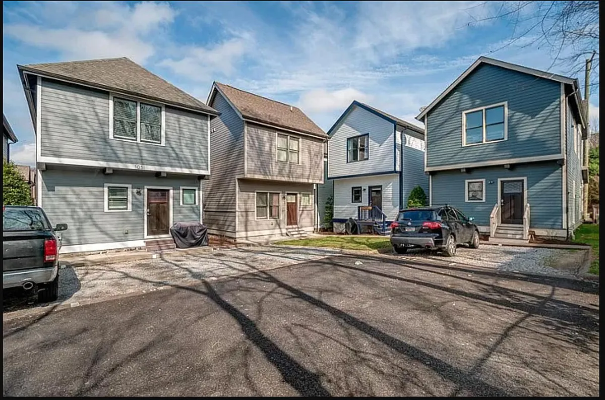 Second house from the left; One designated parking spot - 413 Van Buren St #104