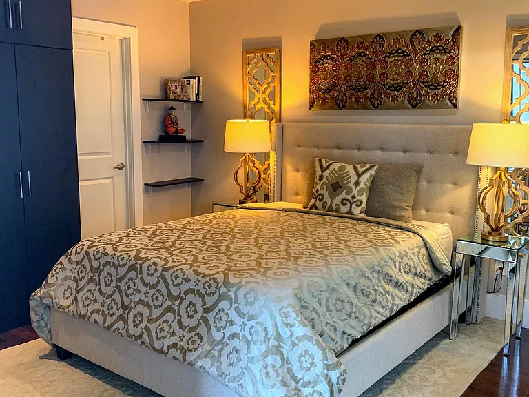 Master bedroom with custom closets and attached bathroom