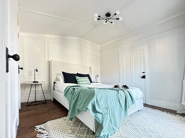 Relax and recharge in this elegant master bedroom