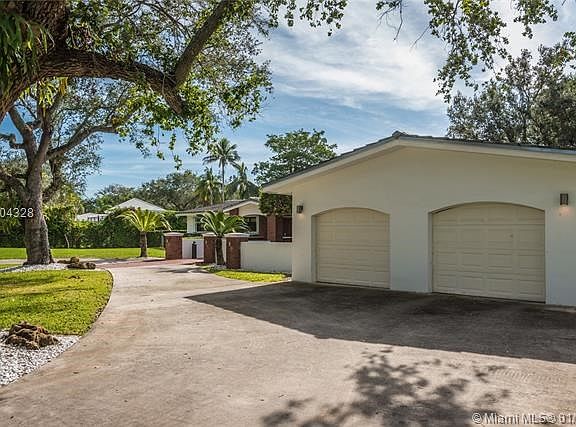 Two-car garage and ample driveway areas